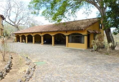 True colonial style home with big areas including pool and rancho