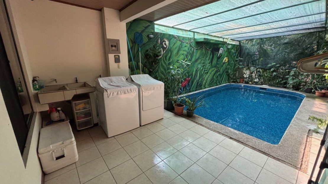 Home in a sanctuary setting with pool and stream