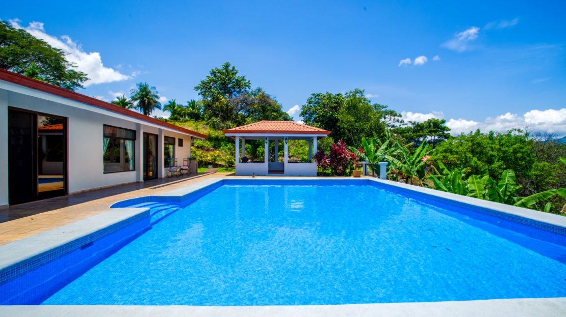 In gated community close to town with large pool and land