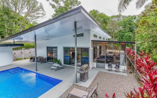 A bright & modern 3-bed home offering TOTAL jungle emersion, a sunny elevated location, river frontage, a rainforest-backed