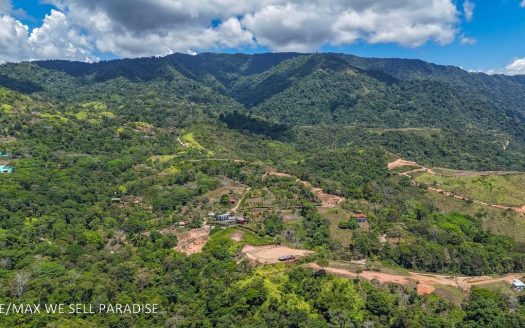 An elevated, prepared lot with 360-degree ocean, mountain, valley and jungle views
