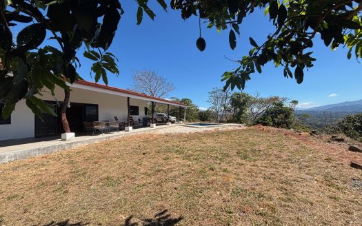 Unique style home and guest home with big views in gated countryside Atenas community.