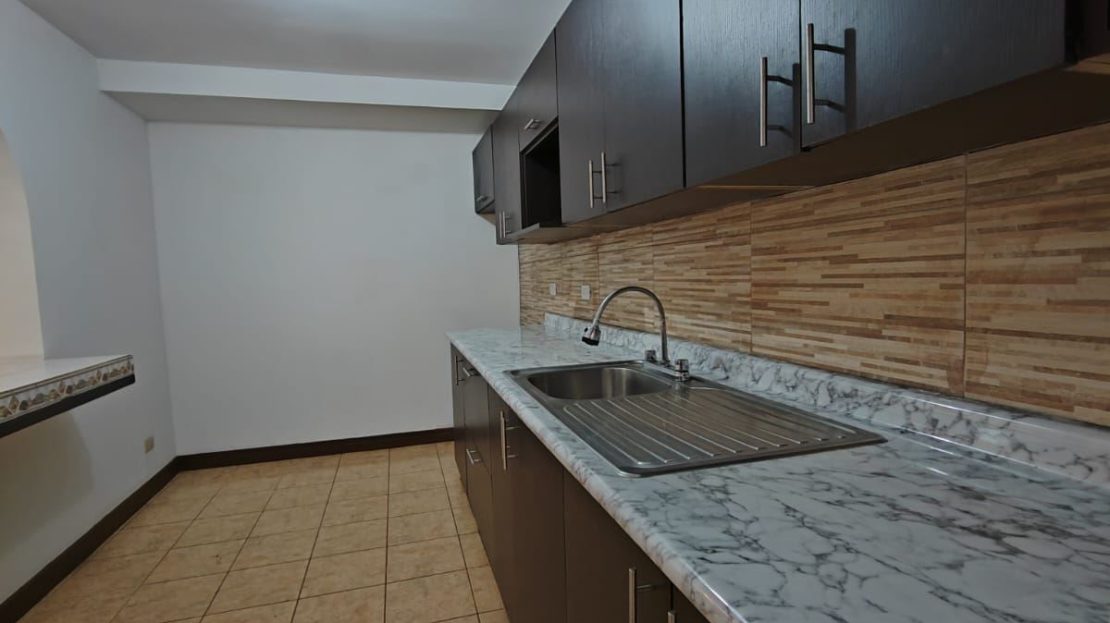 Functional two-story condominium with a two-car garage and private garden. An excellent option for living or investing.