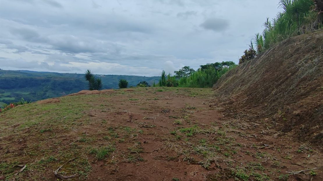 with green areas and beautiful views of the mountains.