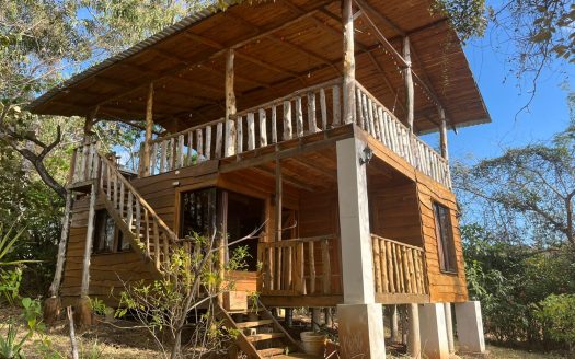 Ocean View Lot with a Charming Wood Cabin in a Gated Community