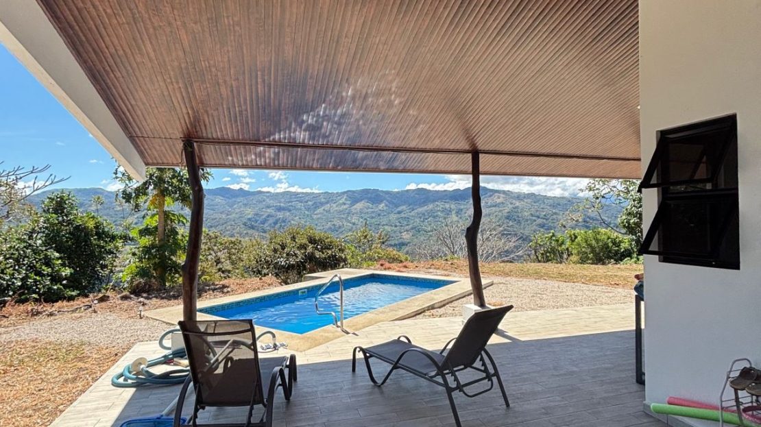 Unique style home and guest home with big views in gated countryside Atenas community.