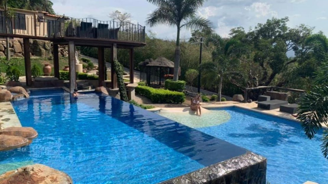 Large manicured property with very unique home in guarded La Guacima community