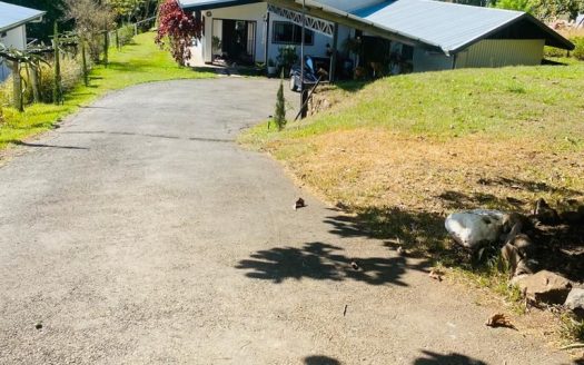 Home with large yard and orchard that touches a river