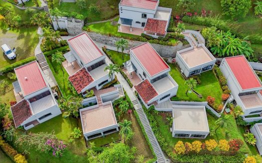 A secure neighborhood of sunny, Mediterranean-style 3 & 1 bedroom villas with full amenities, jungle surrounds, tropical views