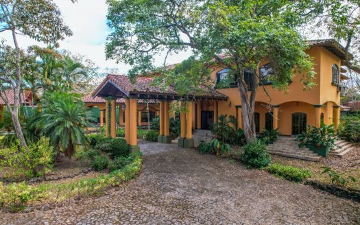 True colonial style home with big areas including pool and rancho