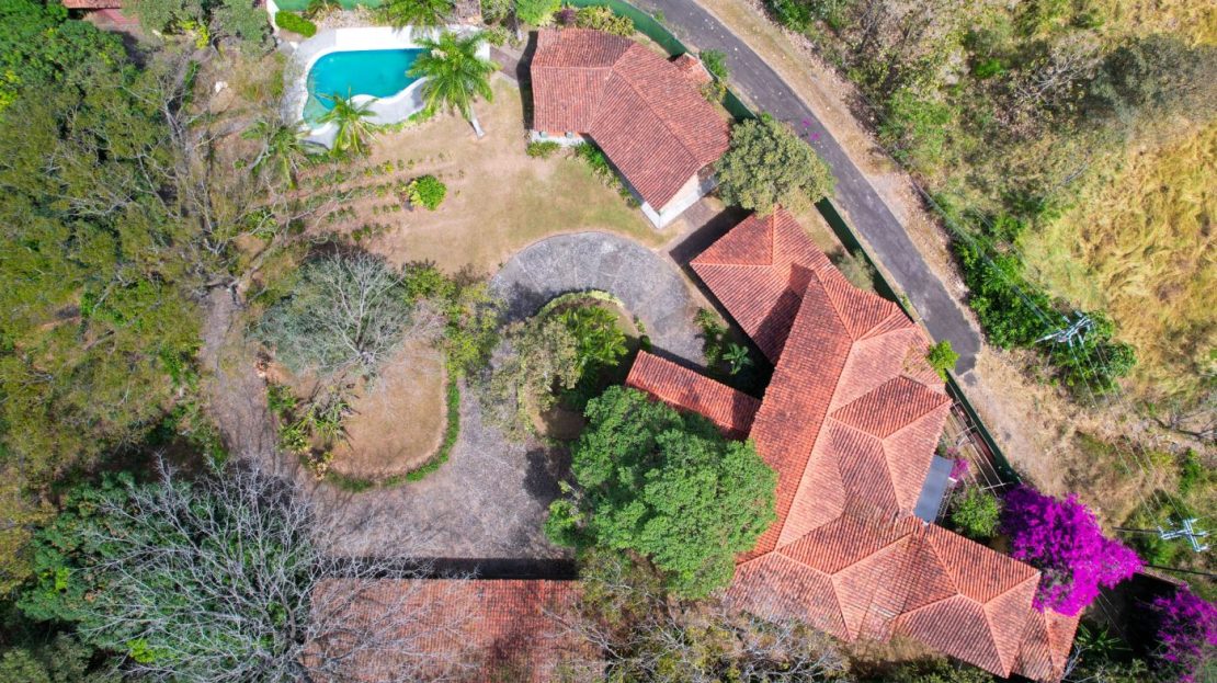 True colonial style home with big areas including pool and rancho