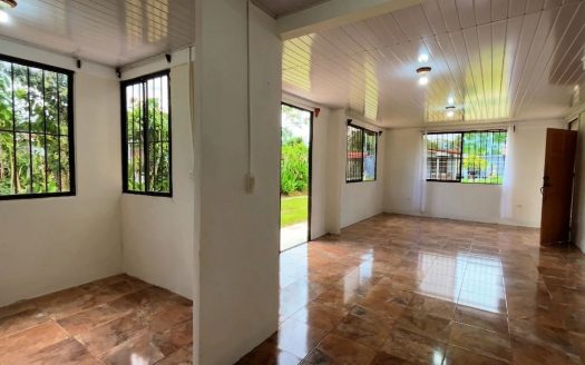 House for Sale in Palmares, Perez Zeledon: Property with Large Flat Lot and Fruit Trees