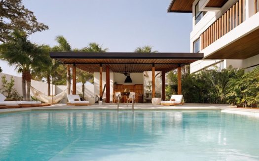 Peaceful and Secure Top-Floor Apartment with Balcony Walking Distance to the Beach – 3B